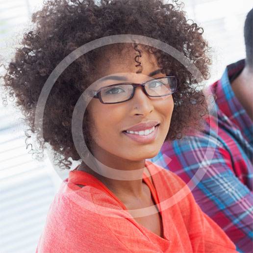 graphic-designer-using-a-graphics-tablet-in-her-office-with-a-colleague-working-behind.jpg